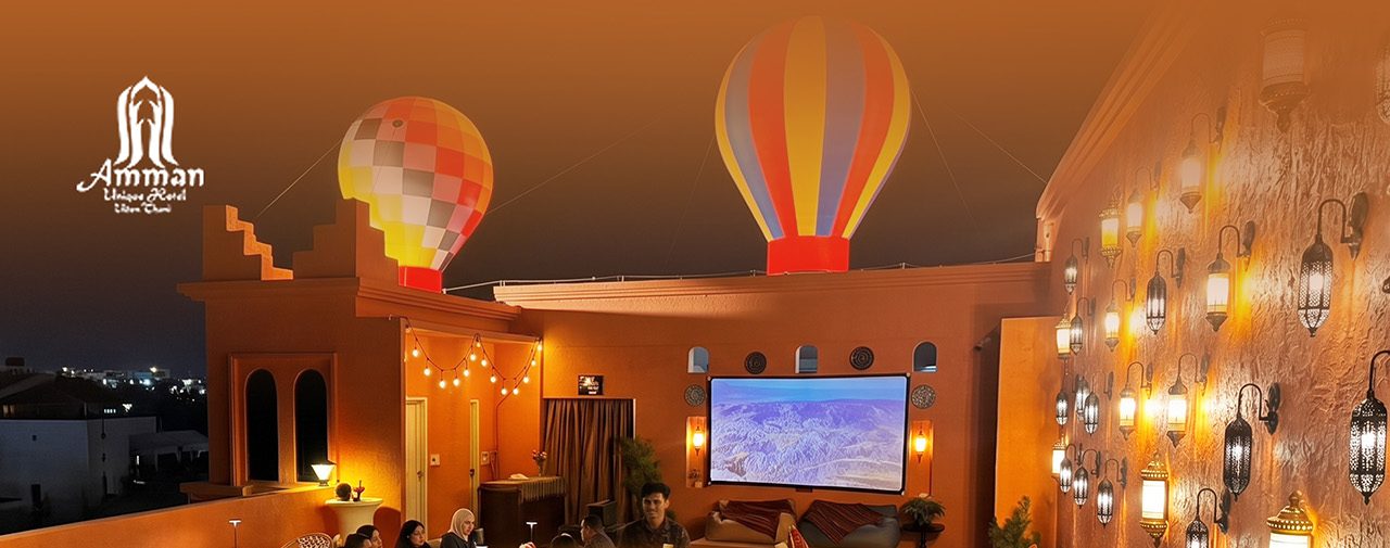 Colourful balloons and Middle Eastern lanterns at Abla Rooftop by night